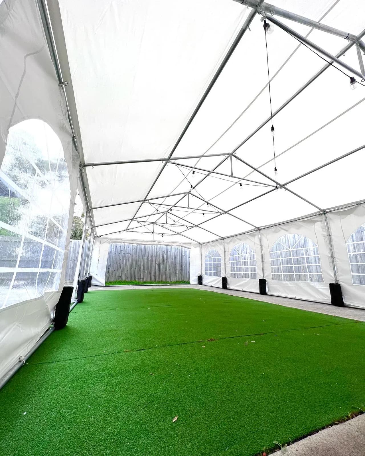 Artificial grass fitted inside a white marquee for a Melbourne event
