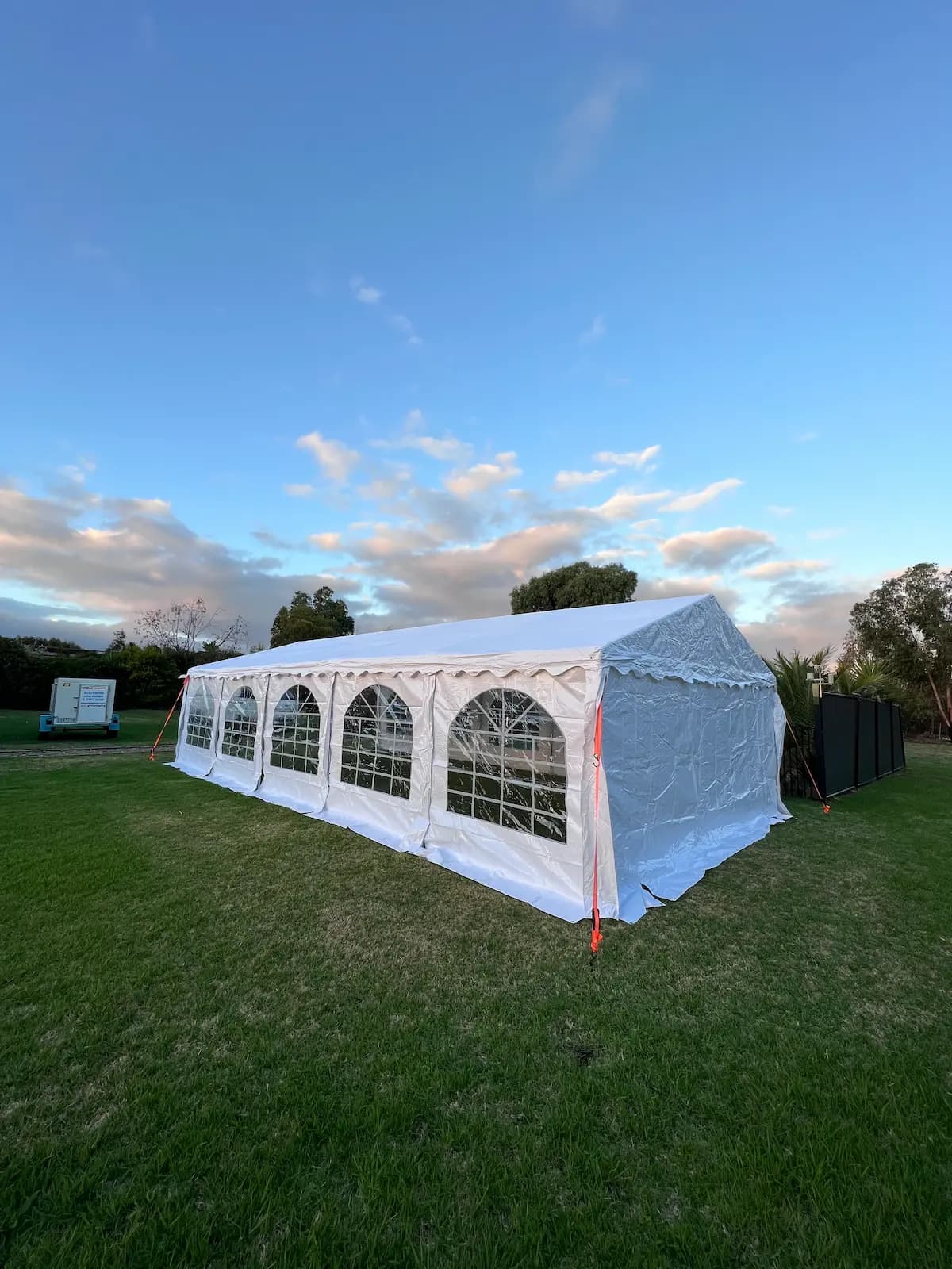 White marquee installed in a garden for a Melbourne party
